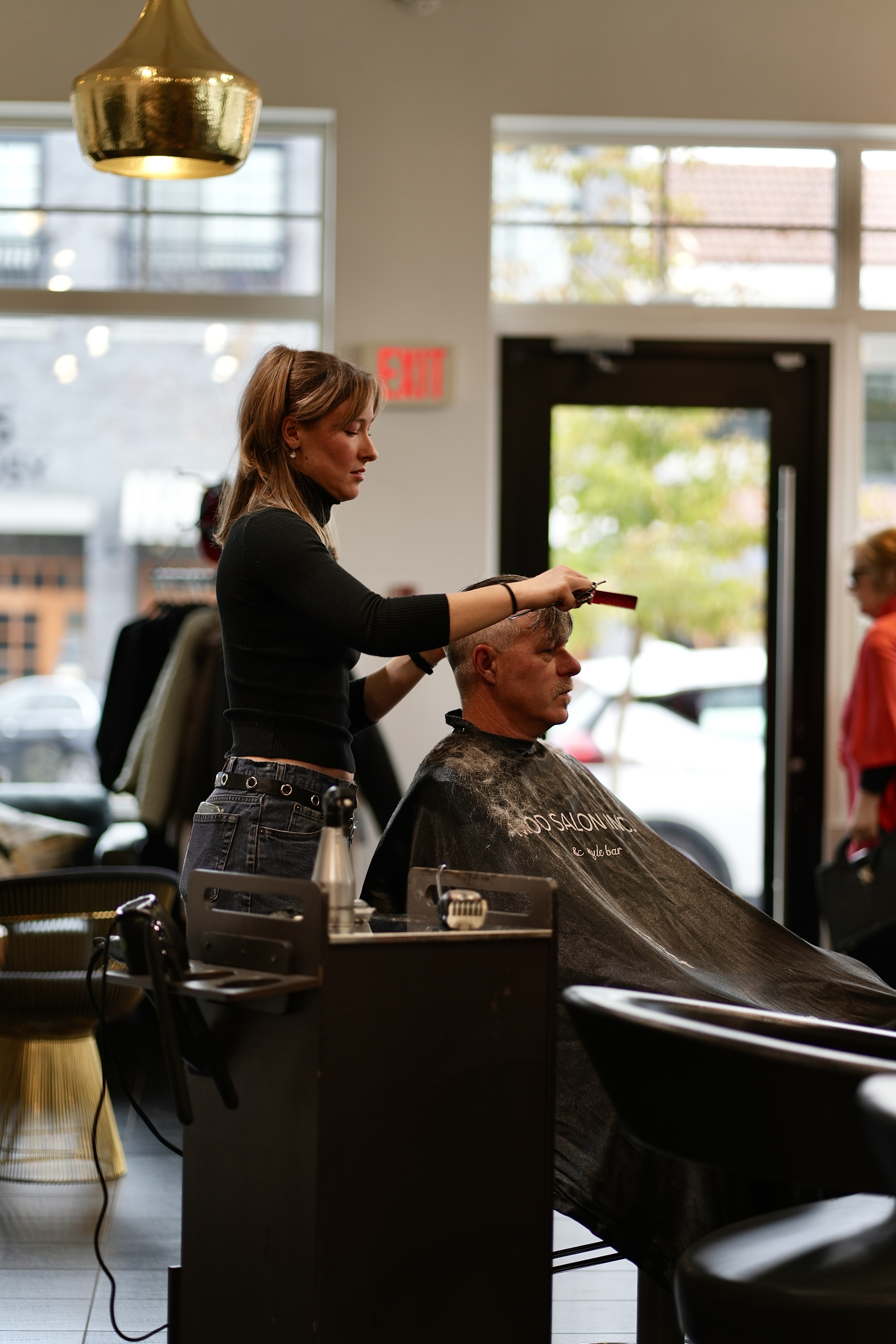 A men's cut in progress at the styling chair