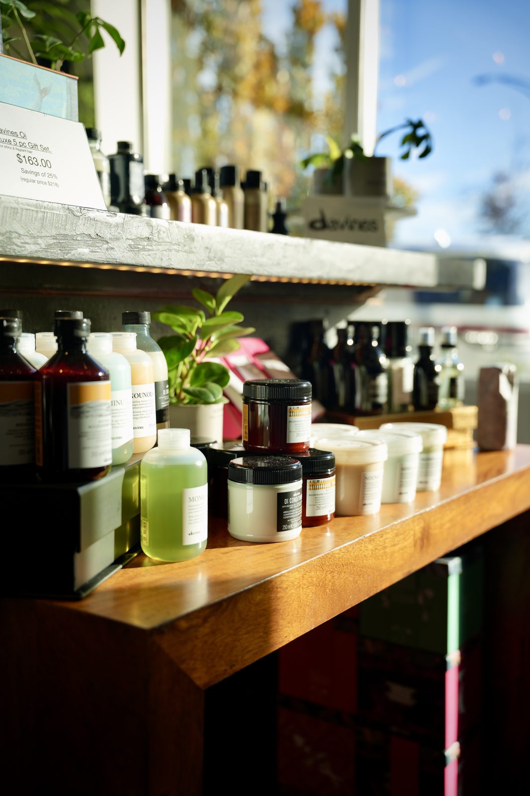 A flatlay of Davines products on a wood counter