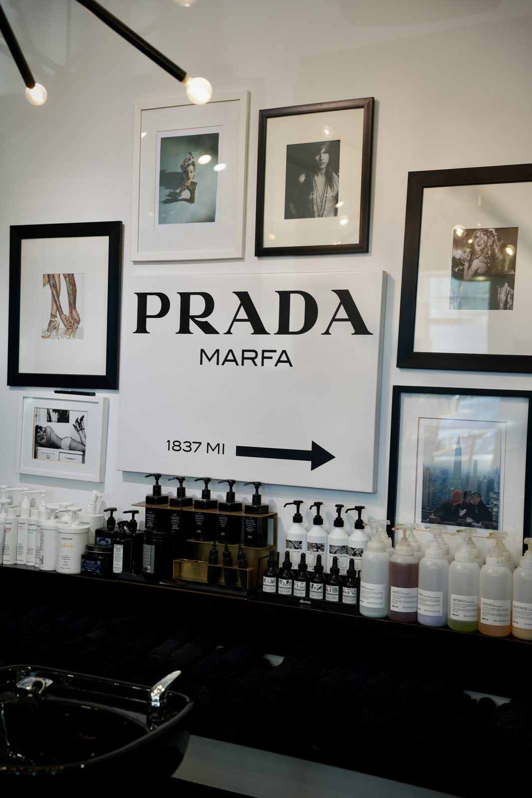 The Prada Marfa print above the product wall